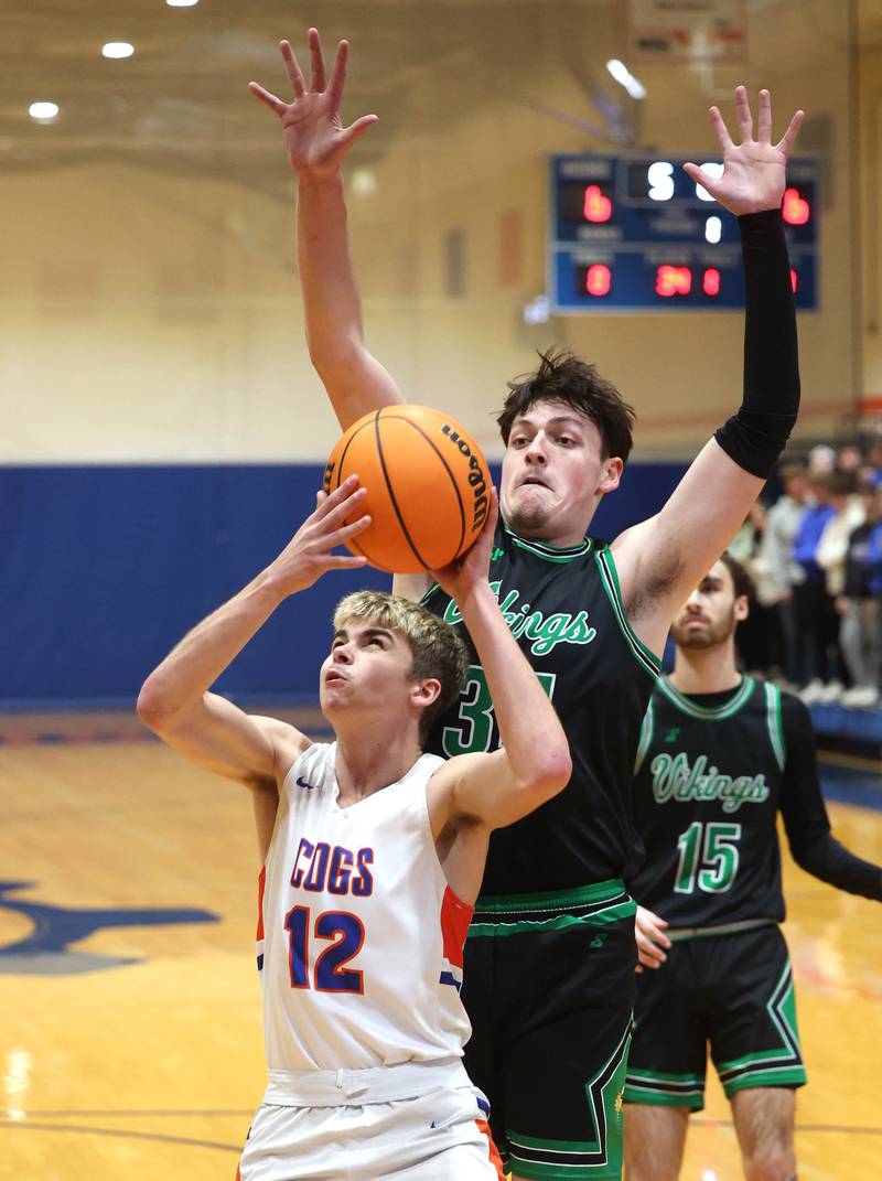 Genoa-Kingston's John Swineheart tries to score in front of North Boone's Ronnie Ragland during their Class 2A regional game Monday, Feb. 24, 2025, at Genoa-Kingston High School.
