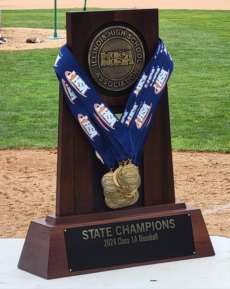The IHSA Class 1A baseball state championship trophy and the medals handed out to the Marquette Crusaders at Dozer Park in Peoria on Saturday.