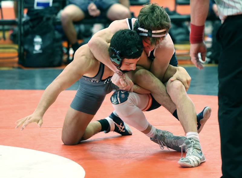 DeKalb’s Ayden Shuey tries to turn Lake Park’s Luca Rutili Wednesday, Nov. 27, 2024, during their 132 pound match at DeKalb High School. Shuey went on to pin Rutili.