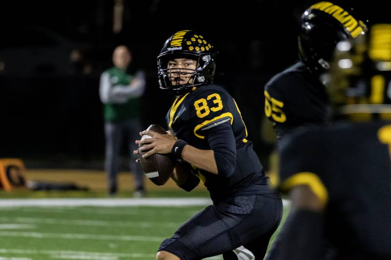Joliet West's Liam Nichtula looks to pass during a varsity football game against Plainfield East at Joliet West on Oct. 10, 2025.