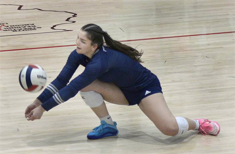 Fieldcrest’s Pru Mangan sets to return a serve against Woodland in the 1st set of Tuesday’s Sub-Sectional match at Woodland.