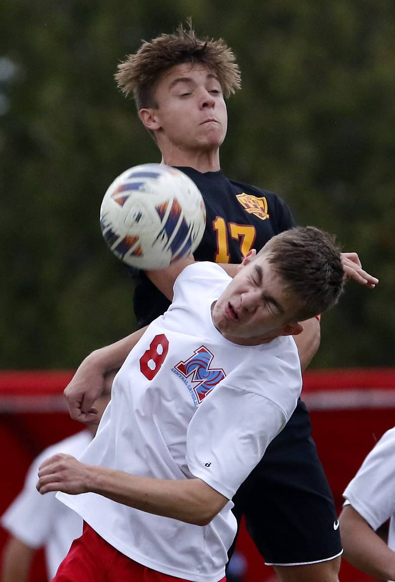Richmond-Burton's Joseph Kyes battles with Marian Central's Nicholas Giesinger for the ball during the IHSA Class 1A Marian Central Regional Boys Soccer Final match on Tuesday, Oct. 22, 2024, at Marian Central High School in Woodstock.