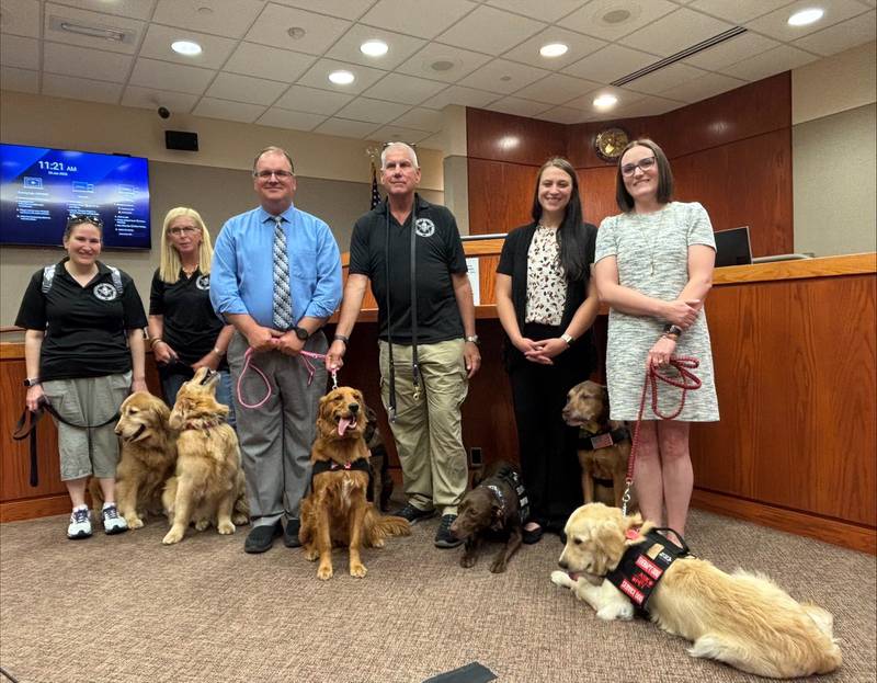 Other services dogs and their handlers joined Honey and Louie and McHenry County courthouse officials as the two service dogs are sworn in on June 24, 2025, at the McHenry County courthouse in Woodstock.