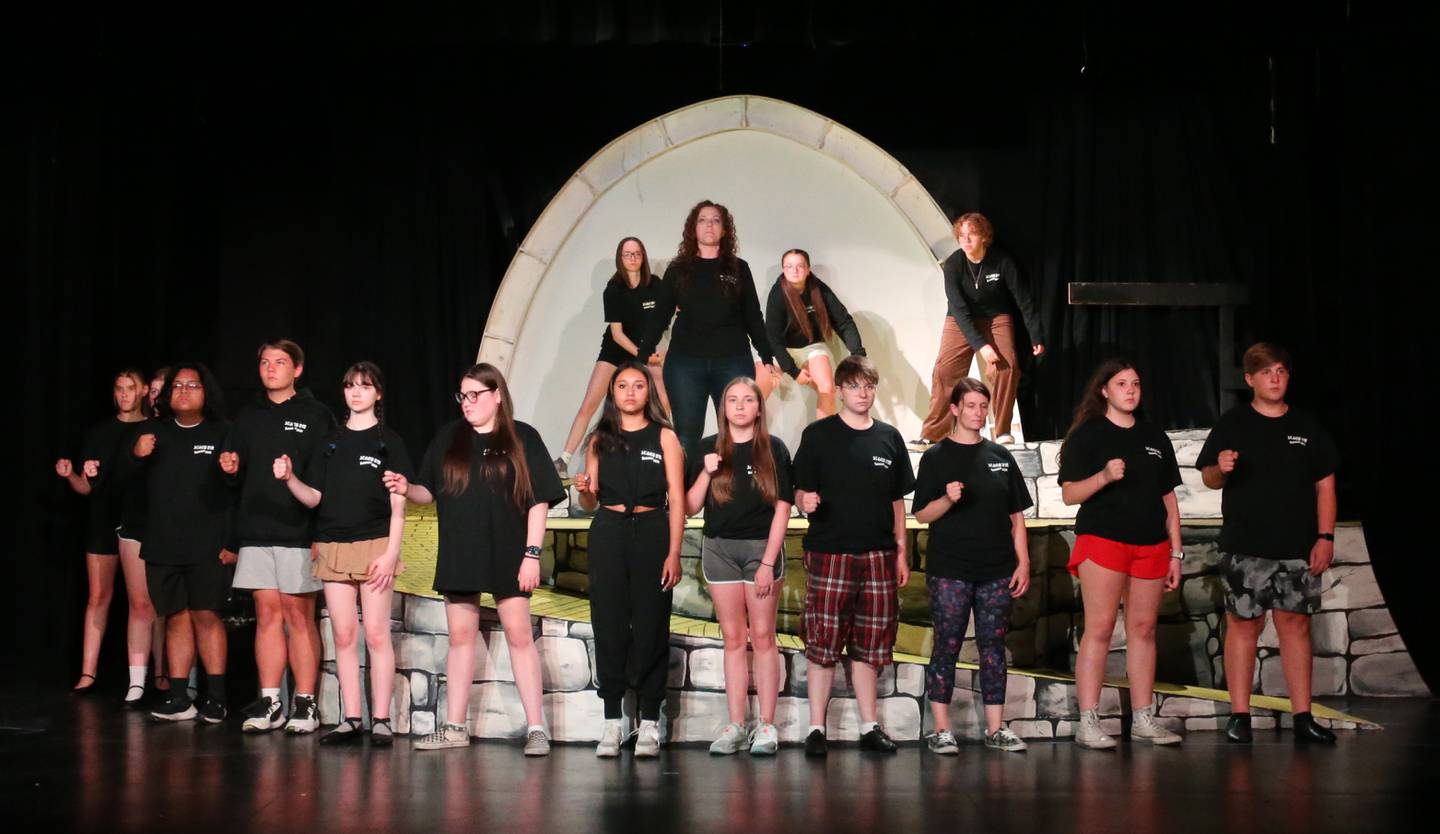 The cast of the "Wizard of Oz" along with Christin Mitchell (top center) performs a scene during a rehearsal of "The Wizard of Oz" on Monday, June 26, 2023 at Stage 212 in La Salle.