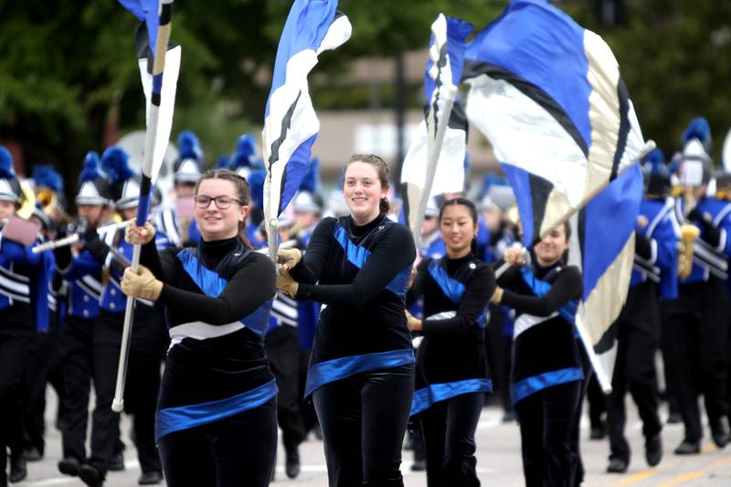 Members of the Geneva High School color guard perform during the school’s homecoming parade on State Street on Friday, Sept. 23, 2022.