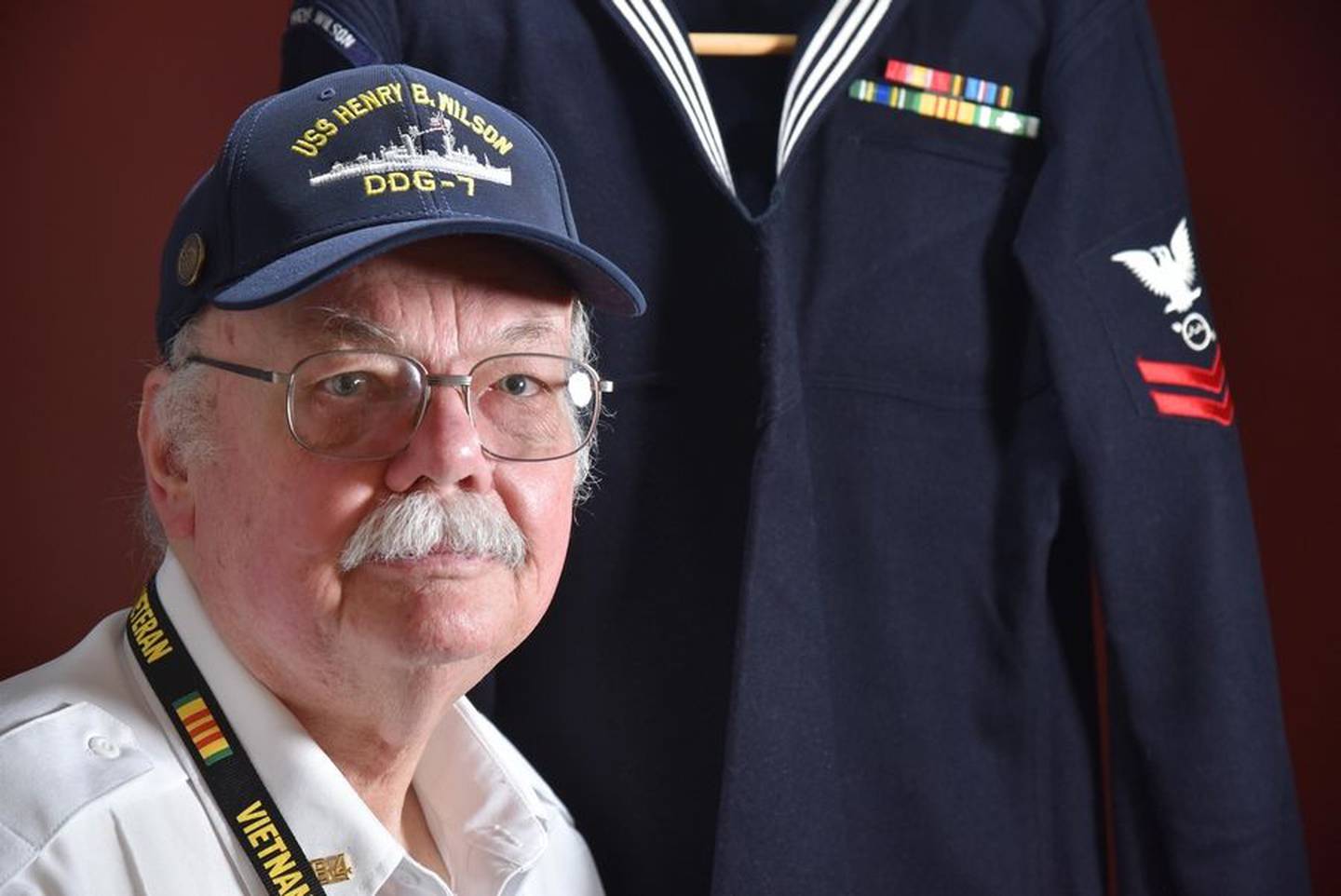 Art Ellingsen of Arlington Heights poses with his Navy uniform. He served aboard the U.S.S. Henry B. Wilson before the ship's involvement in the final battle of the Vietnam War and has since become a historian of both the battle and his old ship.