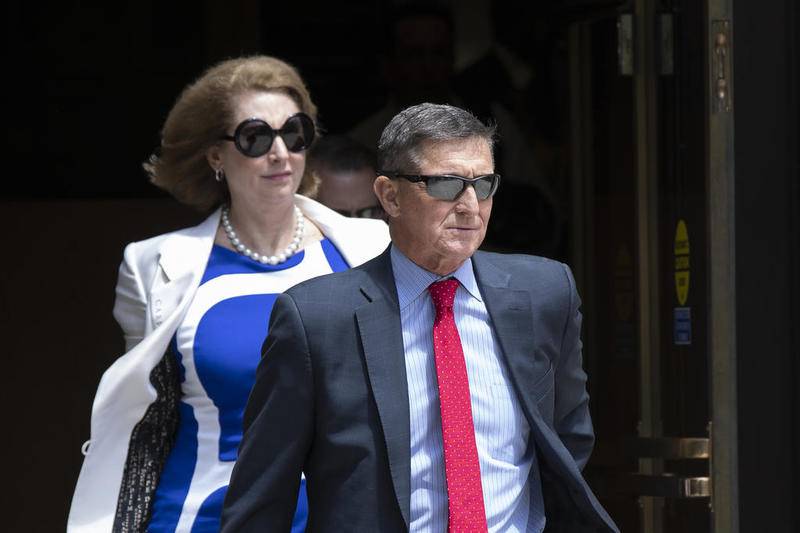 Former national security adviser Michael Flynn, leaves the federal courthouse in Washington, Monday, June 24, 2019.  Flynn's lawyer Sidney Powell, is at left.  (AP Photo/Manuel Balce Ceneta)