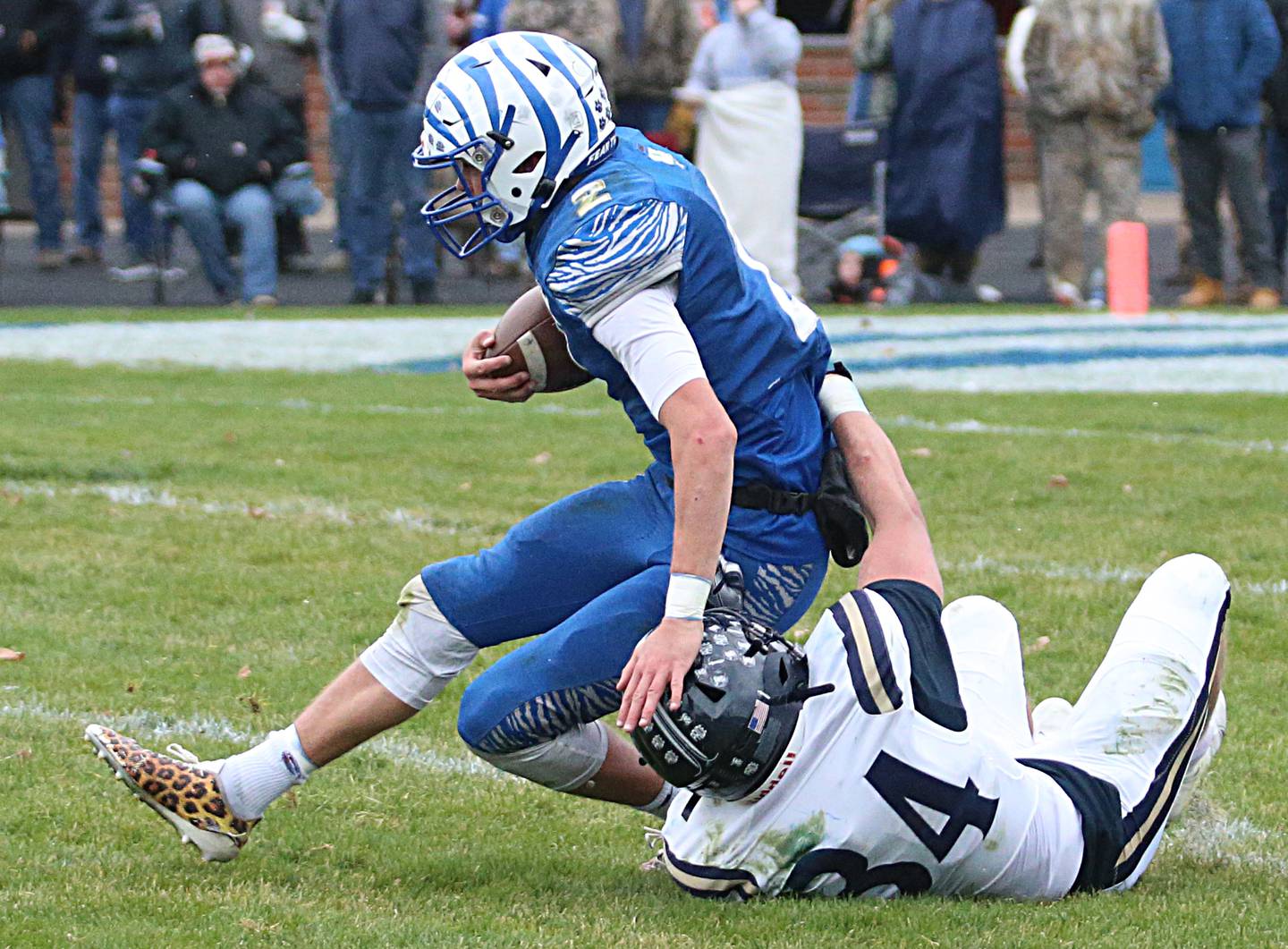 Princeton's Teegan Davis is sacked by IC Catholic's Giovanni Ortiz (34) in the Class 3A Quarterfinal game on Saturday, Nov. 12, 2022 in Princeton.