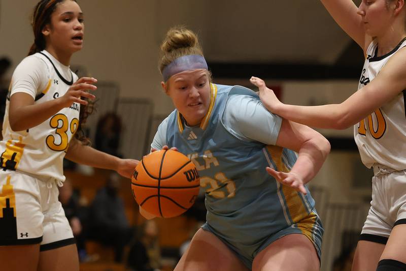 Joliet Catholic’s Emma Birsa works under the basket against Marian Catholic on Wednesday, Jan. 14, 2026 in Chicago Heights.