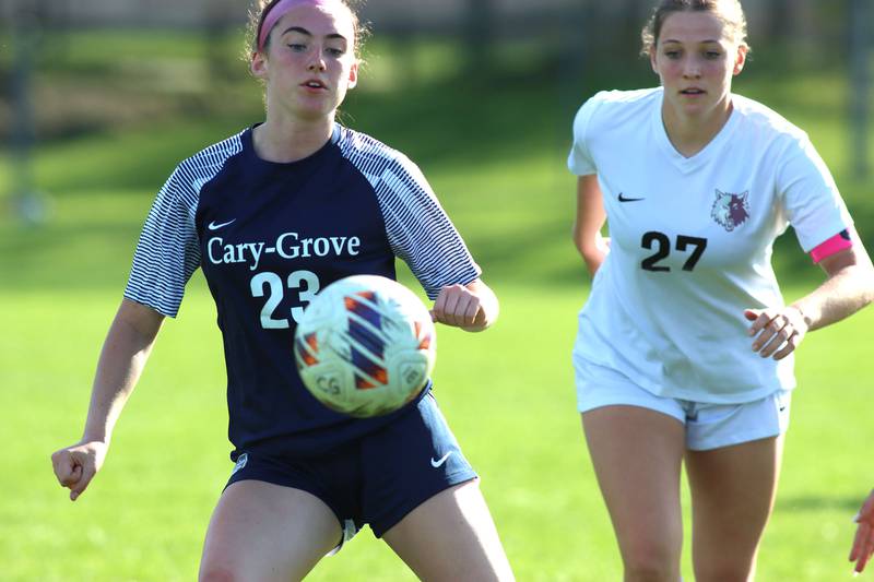 Cary-Grove’s Avery Hoffman, left, and Prairie Ridge’s Ava Gertz play for the ball  in varsity girls soccer at Cary-Grove High School in Cary on Tuesday, April 29, 2025.