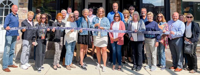 The Sycamore Chamber of Commerce welcoming the Painted Lady Collection with a ribbon-cutting