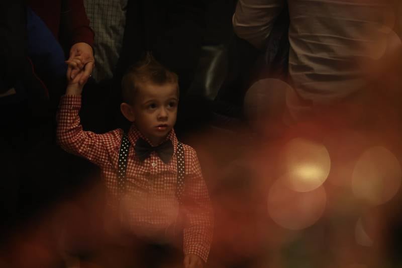 Brian Bessler Jr., 4 year-old, watches as the Rialto Christmas tree is lit up at the A Very Rialto Christmas show on Monday, November 21st in Joliet.