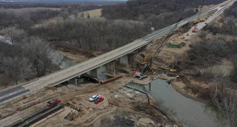 Crews with the Illinois Department of Transportation work on replacing a bridge structure on Interstate 180 over the Tiskilwa Bottom Road on Tuesday, March 18, 2025. According to IDOT, the $24.2 million dollar project includes replacing beams and decking on the current bridge.  During the replacement, only one-lane of traffic in each direction is using the northbound lanes as work happens on the southbound bridges. When that work is complete, traffic will be switched to the southbound lanes to begin work on the northbound bridges.