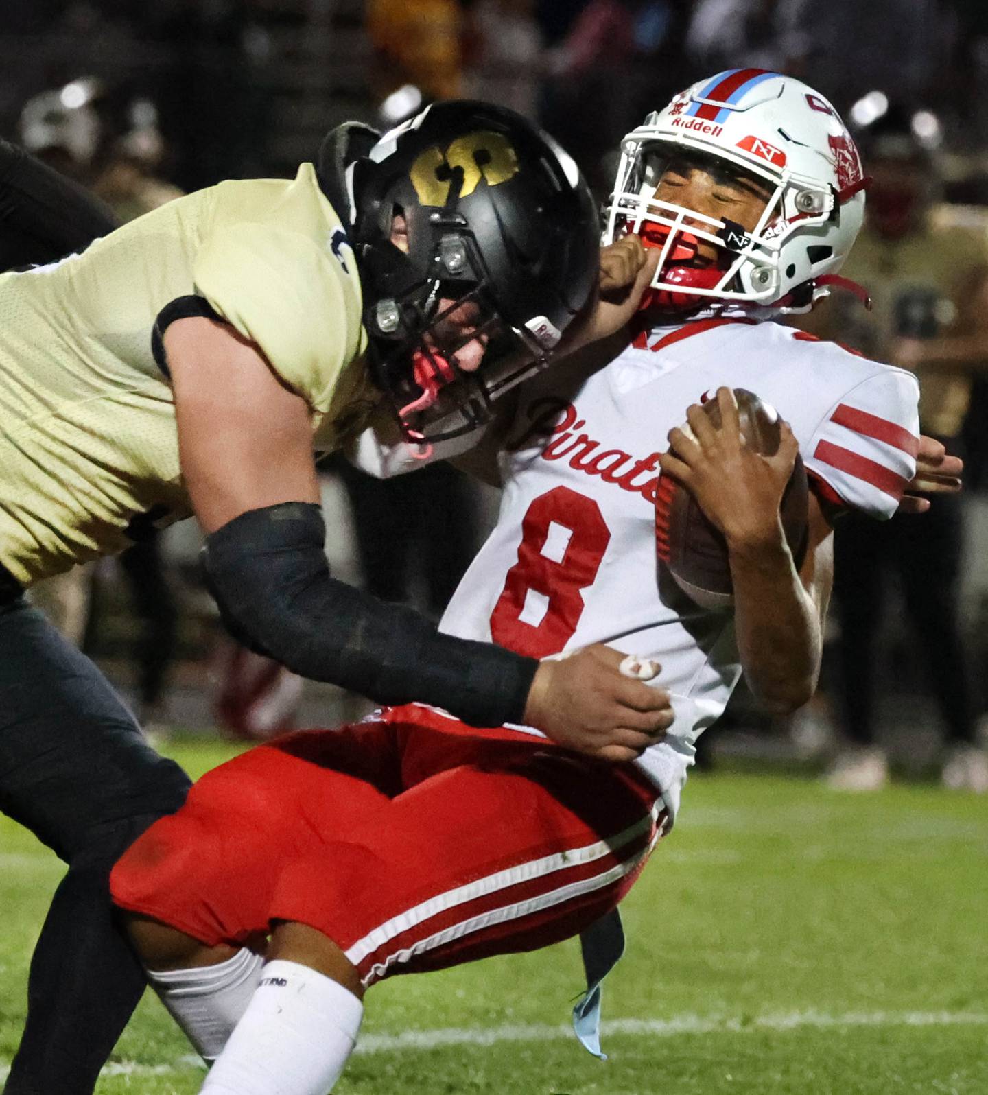 Sycamore's Kyle Prebil lays a big hit on Ottawa's Bryson Valdez during their game Friday, Sept. 27, 2024, at Sycamore High School.