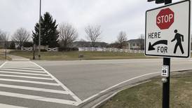 To reduce crashes at McHenry intersection, city will block turn lanes, through lane