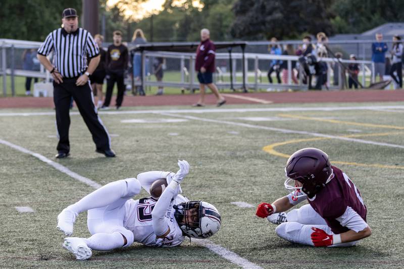 Plainfield North's Tommy Spalding intercepts the ball during a varsity football game against Lockport on Aug. 29, 2025.