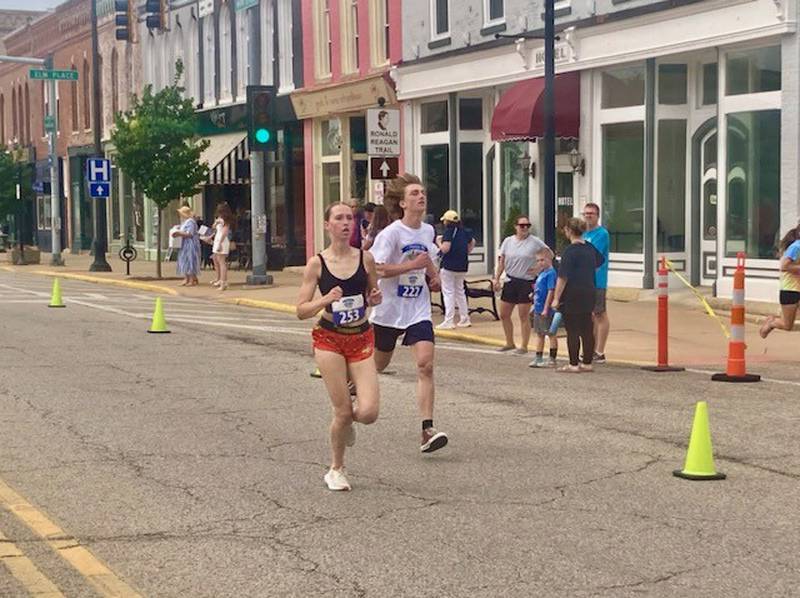 Payton Frueh, 16, of Ohio and Geoge Keutzer, 14, of Princeton finish the Princeton Mile Race Saturday morning.