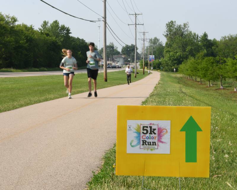 Runners and walkers participate on Saturday, June 7, 2025, during the CASA DeKalb County 5K Color Run held at the Sycamore Middle School.