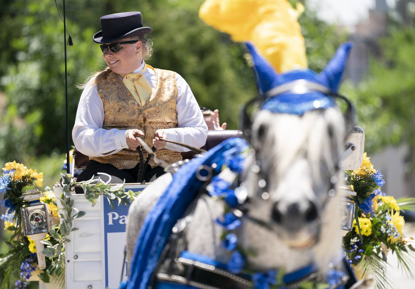 Lyla Blanchard with Royal Carriage Ltd. and her horse Beau, participate during the annual Swedish Days Parade in downtown Geneva on Sunday, June 26, 2022. The parade marked the last day of the festival which ran from June 22-26.