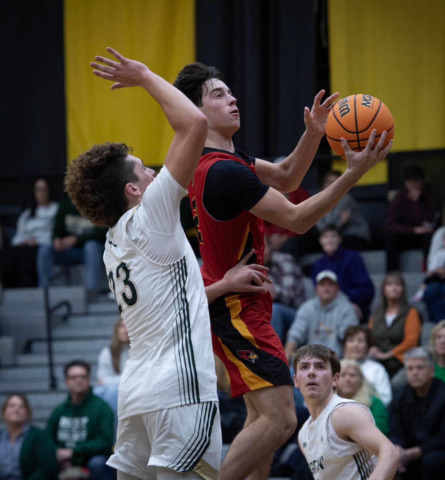 St. Anne's Matthew Langellier elevates for a shot as Bishop McNamara's Karter Krutsinger guards in a game on Wednesday, November 26, 2025.