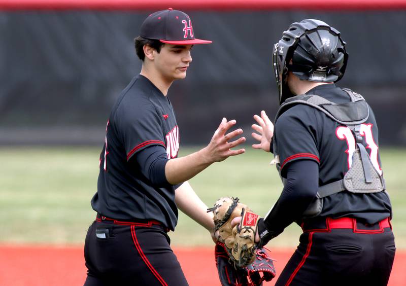 Huntley battery mates Mason Leske, left, and Quinn Drews celebrate getting a third out in varsity baseball at Barrington Saturday.