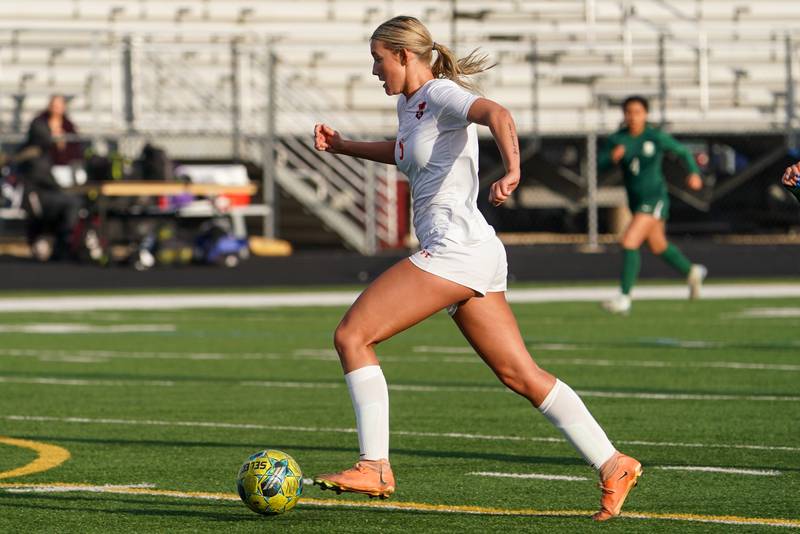 Oswego’s Aubrey Eirich (5) dribbles the ball up field on a fast break against Bartlett during a soccer mach in the Plainfield Classic  at Plainfield North High School on Tuesday, April 15, 2025.