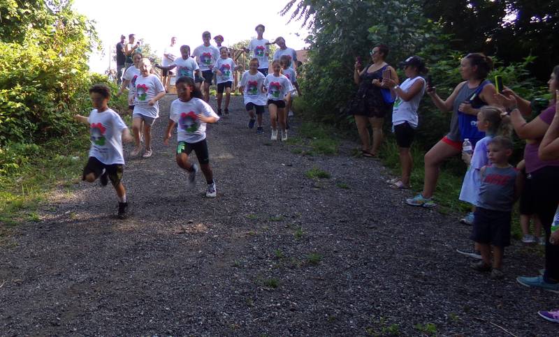 A number of kids set off from Twister Hill Park on Saturday, Aug. 6, 2022, for Safe Journeys first Color Run.