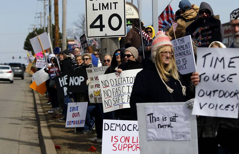 Protesters line State Route 31 near the intersection of McCullom Lake Road in McHenry to protest their discontent with President Donald Trump and his administration's policies on Saturday, March 28, 2026, during the McHenry County No Kings Protest. According to an organizer, over 4,000, people took part in the protest.