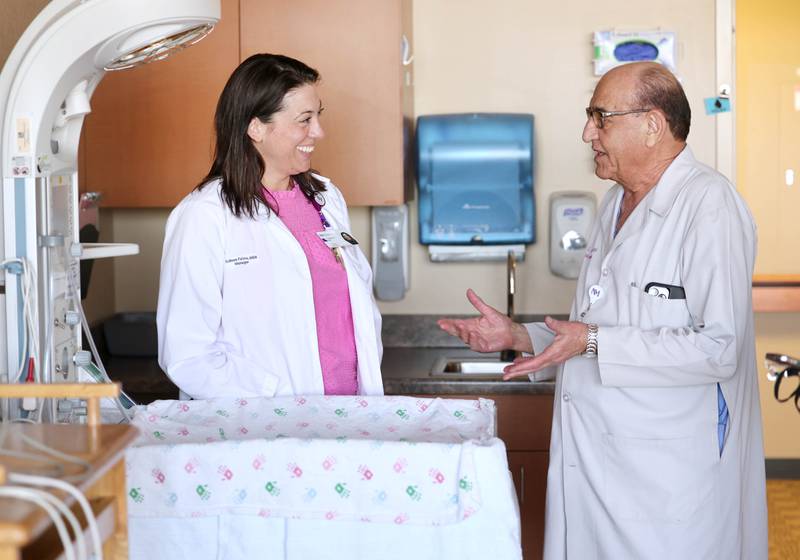 Ismail M. Abbasi MD, one of the available onsite neonatologists at Northwestern Medicine Kishwaukee Hospital, talks to Colleen Faivre MSN, RN, patient care manager in Labor and Delivery at the hospital, Thursday, May 4, 2023, in one of the labor and delivery rooms at the facility in DeKalb.