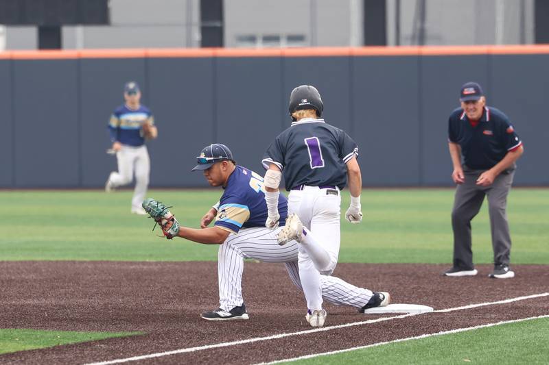 Ottawa Marquette’s Sam Mitre catches the out at first ahead of Lexington's Lexington’s Blaine Friedmansky during the Crusaders' 16-1 victory over Lexington in the IHSA Class 1A State semifinal on Friday, June 6, 2025.