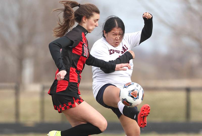 DePue's Miriam Sis kicks the ball away from Indian Creek's Isabella Turner during their game Tuesday, April 5, 2022, at Indian Creek Middle School in Waterman.