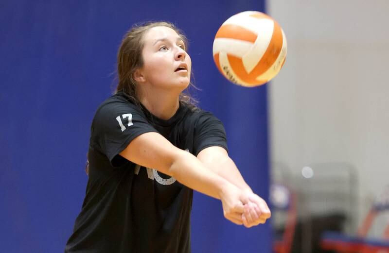 Genoa-Kingston's Lily Mueller bumps a ball Tuesday, Aug. 23, 2022, during volleyball practice at the school in Genoa.