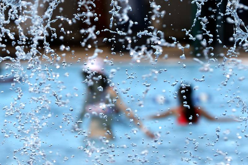 People enjoy the water while swimming on Friday, June 21, 2024, at Woodstock Water Works.