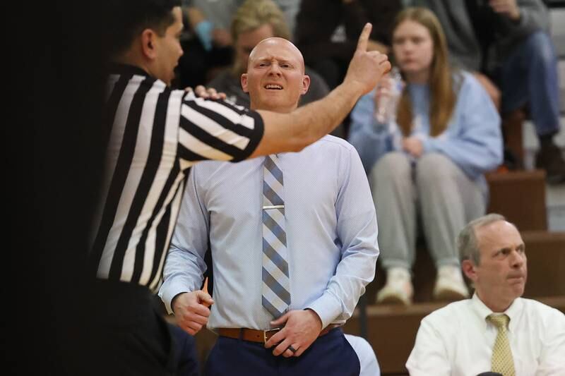 Joliet Catholic head coach Adam DeGroot reacts to a fouls called against the Hilltoppers in the Class 2A Julian Sectional championship on Friday, March 3rd, 2023 in Chicago.