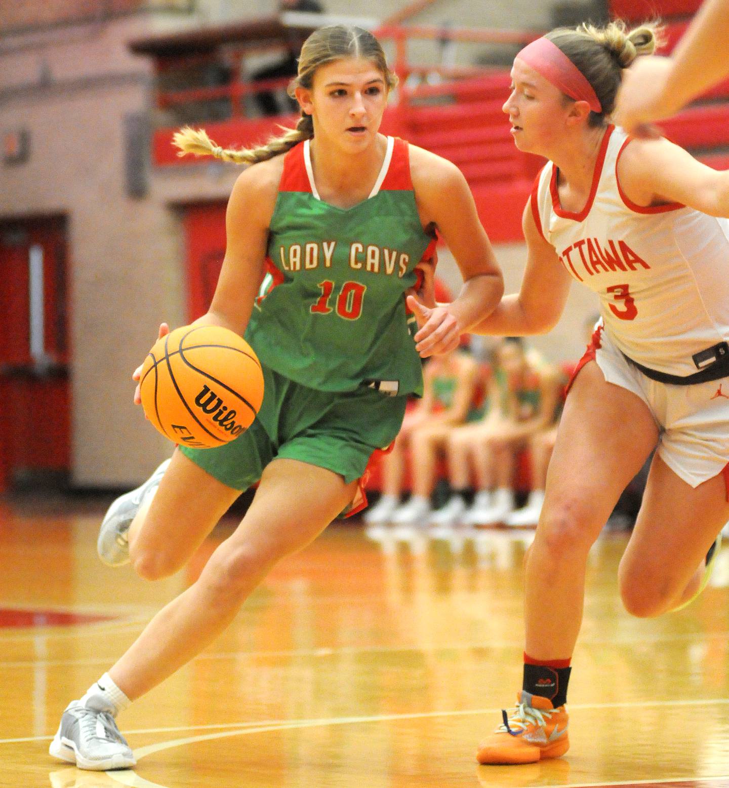 La Salle-Peru's Kelsey Frederick dribbles around Ottawa's Skylar Dorsey on Friday, Dec. 13, 2024, at Kingman Gym.