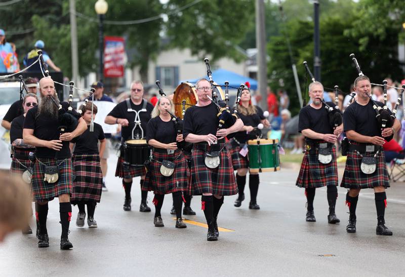 The City of Rockford Pipe Band plays as they march down Main Street Friday, July 4, 2025, during the Fourth of July parade in downtown Kirkland.