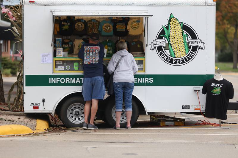 A couple checks out the merchandise trailer at the 75th Annual Grundy County Corn Festival on Saturday, Sept. 28, 2024 in downtown Morris.