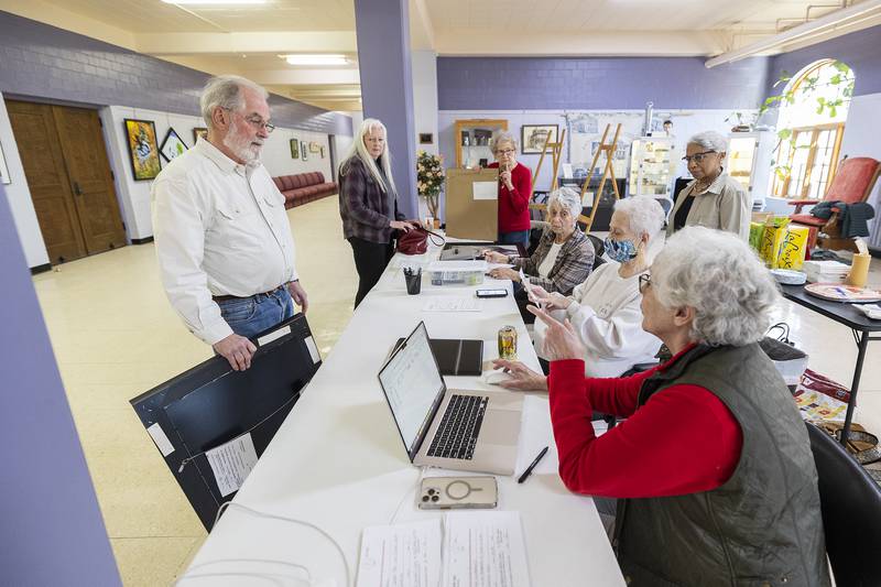 Artists Dick Cholke and Kim Gerry drop off works Monday, March 31, 2025, to be included in the 2025 Phidian Art Show.