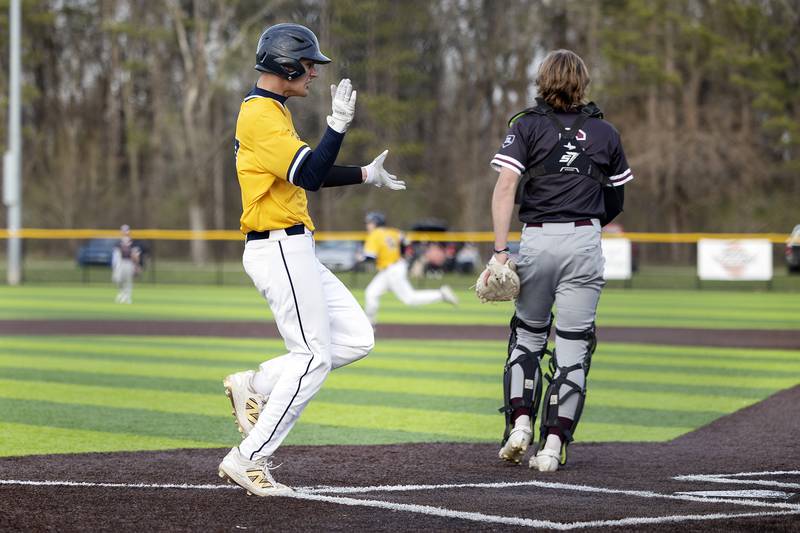 Sterling’s Mason Hubbard celebrates scoring against Moline Wednesday, April 16, 2025. The Warriors hung five runs on Moline in the sixth inning and went on to win 5-4.