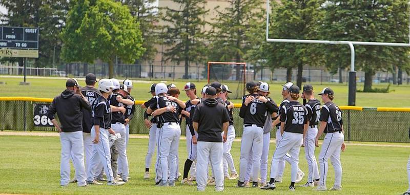 Kaneland players comfort each other after the loss to Benet at the Class 3A Kaneland Regional Final on Saturday, May 31, 2025 in Maple Park.
