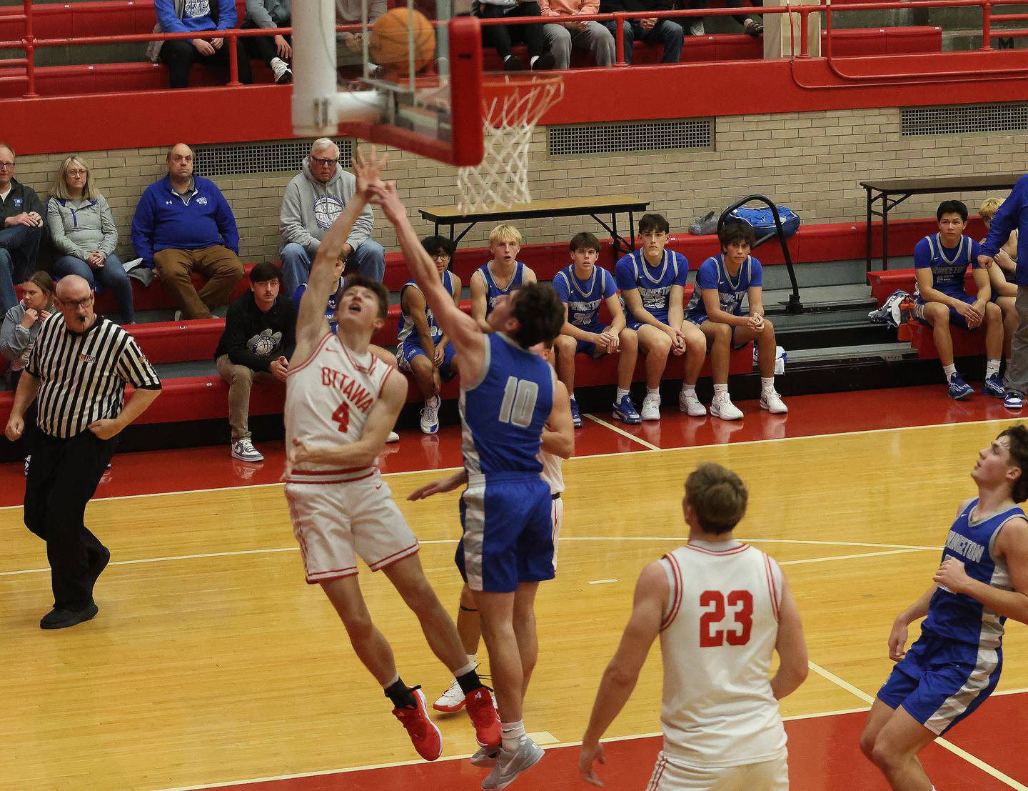 Ottawa's Colt Bryson lets go of a shot over Princeton's Jackson Mason during the Dean Riley Shootin' The Rock Thanksgiving Tournament on Monday Nov. 24, 2025 in Kingman Gymnasium at Ottawa High School.