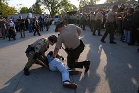 Noem visits Chicago area ICE facility as agents detain multiple protesters outside