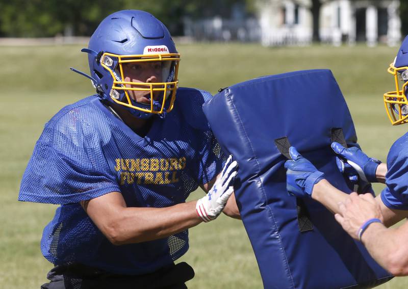 Branden Olsen practice his defensive rushing during summer football practice Thursday, June 23, 2022, at Johnsburg High School in Johnsburg.