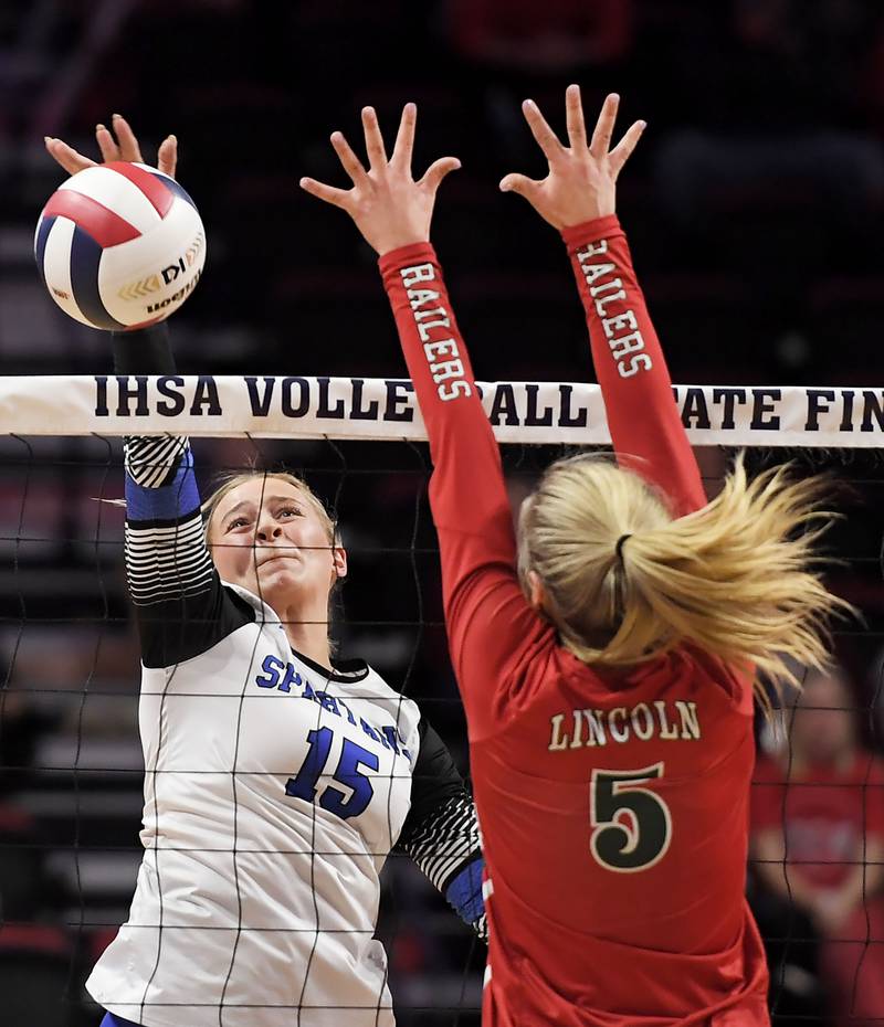 St. Francis’ Gabriella Rendina gets the ball past Lincoln’s Kloe Froebe in the Class 3A girls volleyball state championship match at Illinois State University in Normal on Saturday, October 11, 2023.