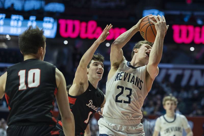 New Trier’s Jake Fiegen takes a pass down low against Benet Academy’s Sam DriscollFriday March 10, 2023 during the 4A IHSA Boys Basketball semifinals.