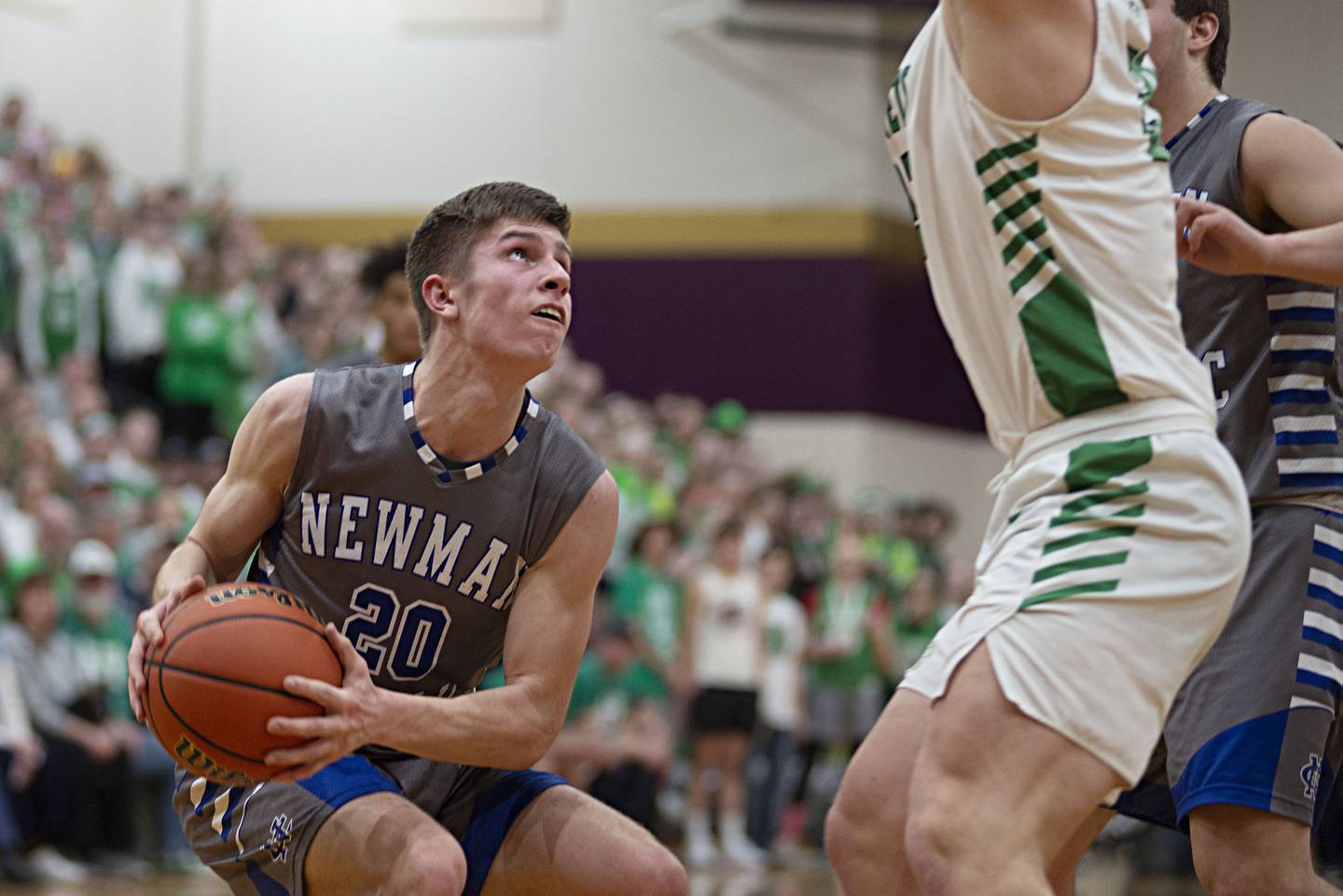 Newman's Owen McBride looks to put up a shot against Scales Mound in the sectional final Friday, March 4, 2022.