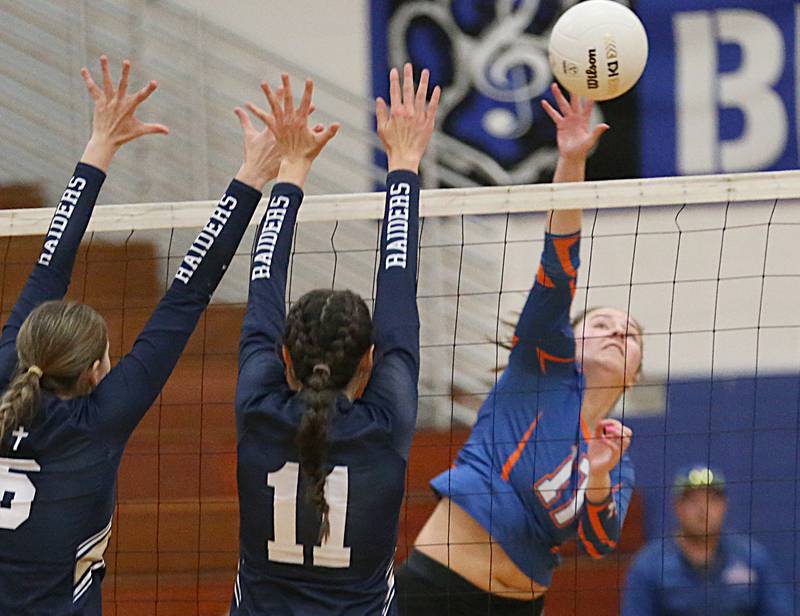 Genoa-Kingston's Kaitlin Rahn (6) sends a kill past Quincy Notre Dame's Abbey Schreacke (14) in the Class 2A Supersectional volleyball game on Friday, Nov. 4, 2022 at Princeton High School.