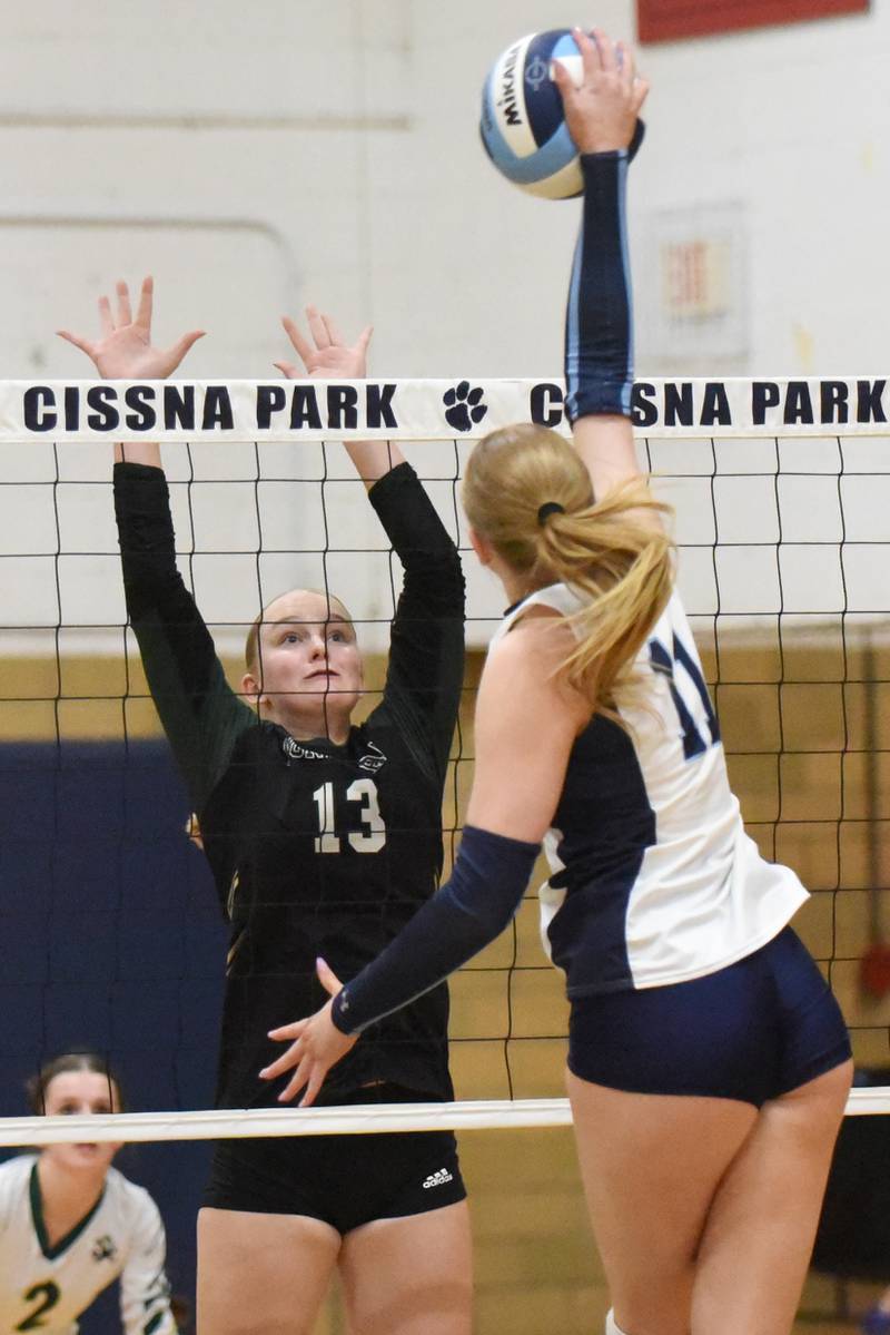 Bishop McNamara's Emma Thyfault, left, looks to block a hit from Cissna Park's Sophie Duis during a game at Cissna Park Wednesday, Oct. 15, 2025.