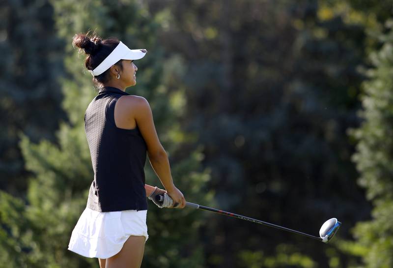 Benet Academy’s Reina Maceren tees off during the Class 2A Waubonsie Valley Girls Golf Sectional on Monday, Oct. 6, 2025 at Springbrook Golf Course in Naperville.
