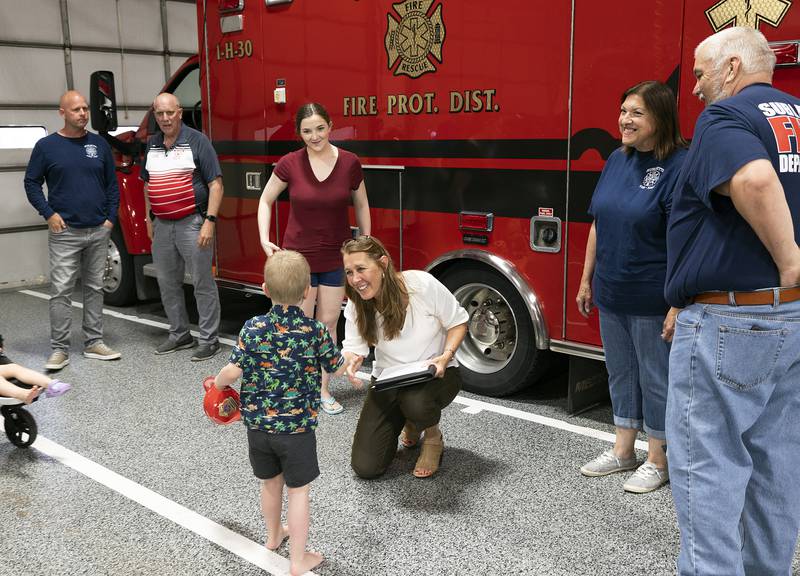 Lee County 911 Director Shelley Dallas speaks with River Edwards, 4, Thursday, May 15, 2025, at the Sublette Fire Department. Dispatchers and Sublette Fire EMS received a thank you for helping the Edwards family through the birth of their newest baby, Wilder.